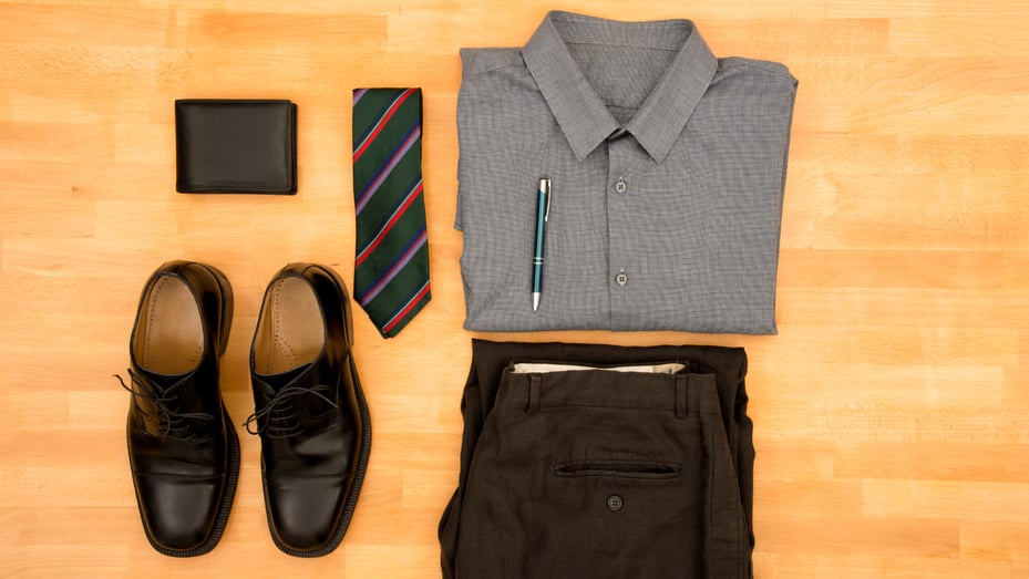 Men's business clothes laid out and folded | Dress for Your Day: Blue's Dress Code Policy