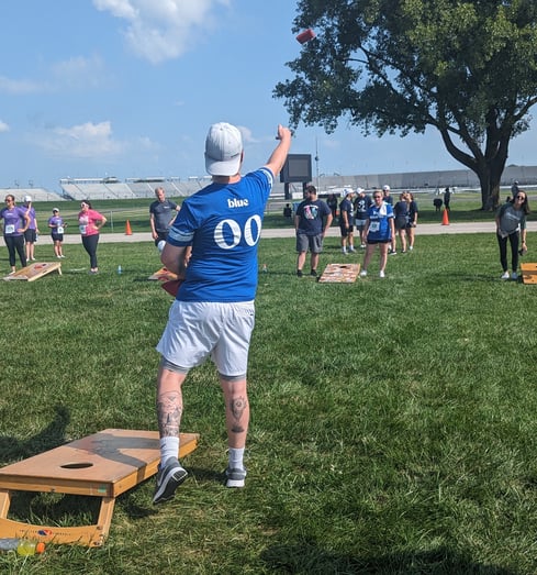 Blue and Co. employees playing cornhole at the Indiana Corporate Challenge 