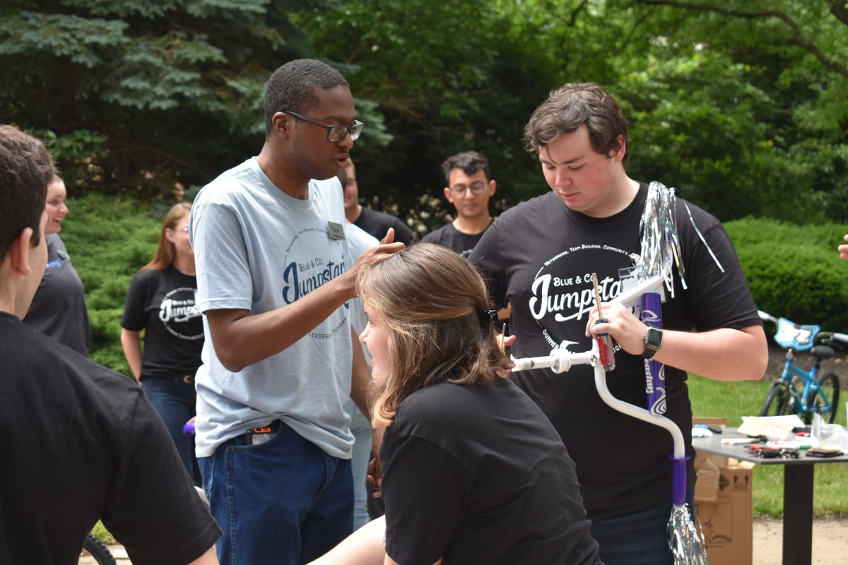 Staff and Students Building a bike at the Summer Leadership Program at the Columbus Ohio Office