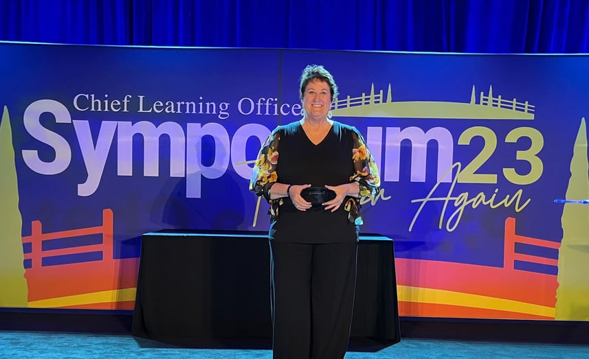 Jan Green accepting the LearningElite Bronze award on behalf of Blue & Co., LLC, at the Chief Learning Officer Symposium in San Diego, California