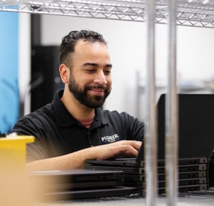 IT expert performing IT assessment on his laptop