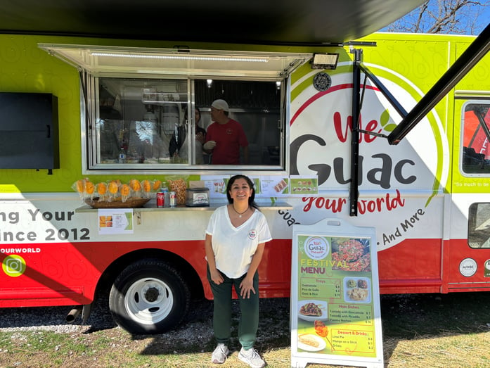 Myriam Boyer smiling in front of her food truck | We Gauc Your World